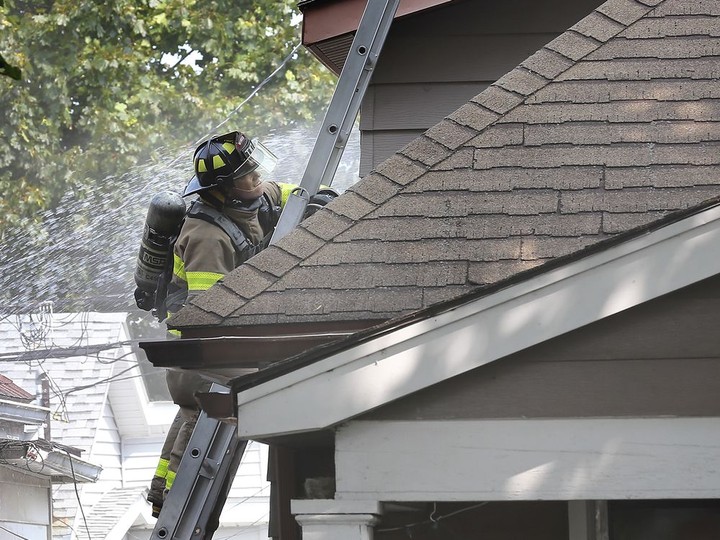  A Windsor firefighter is shown at the scene of a house fire on Tuesday, September 15, 2020 in the 1200 block of Hickory Rd. Four adults and two children were displaced and a neighbour who tried to extinguish the fire was treated for minor smoke inhalation.