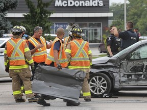 Emergency personnel are shown at the scene of a collision between a tractor trailer and a car at the intersection of Huron Church Road and College Avenue on Wednesday, September 9, 2020. The accident occurred at approximately 2:15 p.m. and caused significant backups in the northbound lanes of Huron Church. Injuries were not life-threatening.