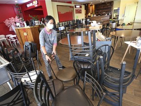 Mei Huang of the Jade Chinese Cuisine sets up the eatery's new location in the Ambassador Plaza on Huron Church Road in Windsor on Wednesday, Sept. 9, 2020.