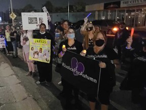 Attendees of the third annual candlelight vigil for murdered Windsor-Essex young people rally at 2366 Dougall Ave. on Sept. 23, 2020.