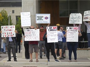 WINDSOR, ONT:. SEPTEMBER 28, 2020 -- Protesters opposed to wearing masks rally outside city hall during a city council meeting, Monday, September 28, 2020.