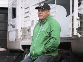 David Cordero-Perez, a Mexican migrant worker for Durocher Farms in LaSalle is shown on Friday, September 18, 2020, next to a camper that the farm owners purchased for him while he recuperates from cancer treatment.