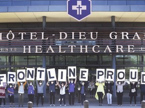 'Frontline Proud.' Unionized and management staff at Hôtel-Dieu Grace Healthcare in Windsor are shown June 11, 2020, at a demonstration held to send a message to Ontario Premier Doug Ford that all front-line workers should qualify for the province's pandemic pay increase.
