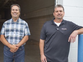 Tim Pare, owner of Botley Robotics, and an associate, Ted Matthieu, are pictured outside a new production facility on North Service Road, Wednesday, Sept. 2, 2020.