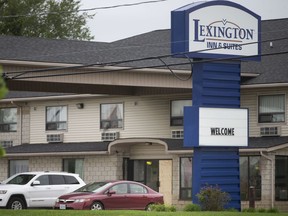 A boarded-up front door to the Lexington Inn & Suites on Division Road is pictured, Thursday, September 10, 2020.