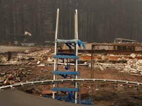 The remains of a slide are seen in the yard of a home destroyed by fire in the Cascade mountain range during the aftermath of the Riverside Fire near Molalla, Oregon, Wednesday, Sept. 16, 2020.