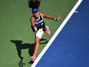 Sep 4, 2020; Flushing Meadows, New York, USA; Naomi Osaka of Japan hits a forehand against Marta Kostyuk of Ukraine (not pictured) on day five of the 2020 U.S. Open tennis tournament at USTA Billie Jean King National Tennis Center. Mandatory Credit: Danielle Parhizkaran-USA TODAY Sports     TPX IMAGES OF THE DAY