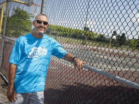 Bill Seagris is pictured next to the tennis courts at St. Thomas of Villanova Catholic High School, Tuesday, September 1, 2020.  Seagris is hoping to  fix the courts.