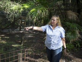 In this July 20, 2017, file photo, Carole Baskin, founder of Big Cat Rescue, walks the property near Tampa, Fla.