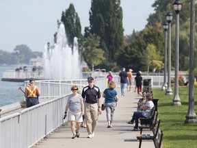 WINDSOR, ONT:. SEPTEMBER 25, 2020 -- The riverfront pathway near the Peace Fountain at Reaume Park is full of walkers on a sunny Friday afternoon, September 25, 2020.