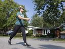  Jory Fulcher, a masters student in human kinetics at the University of Windsor, walks down her street in South Windsor, Thursday, September 25, 2020.  Fulcher uses a Fitbit to track her walking for a University of Windsor study on walking during the pandemic.
