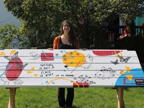Artist Kristina Bradt and her work Home Away From Home - a reimagined picnic table at the Dominion House tavern. The public art piece is one of four recently added to the West End Art Project.