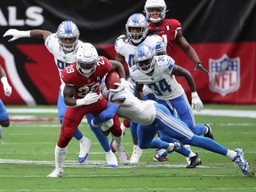 Detroit Lions Julian Okwara (No. 99), seen at left chasing Arizona running back Chase Edmonds (No. 29) earlier this season, was placed on the injured list on Wednesday.