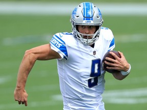 Matthew Stafford of the Detroit Lions runs with the ball against the Jacksonville Jaguars during the first quarter in the game at TIAA Bank Field on October 18, 2020 in Jacksonville, Florida.