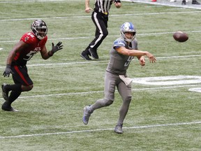 Detroit Lions' quarterback Matthew Stafford #9 steps into the winning touchdown throw to tight end T.J. Hockenson (not pictured) as time expires in the fourth quarter against the Atlanta Falcons at Mercedes-Benz Stadium on Sunday.