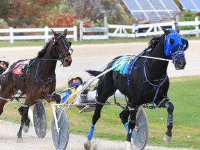 Leading driver Marc E. St. Louis takes Sunshine N Shade to the top in the 3rd race of Sunday's harness racing card from Leamington Raceway located on the Leamington Fairgrounds October 18, 2020.