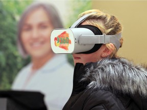 In this Nov. 7, 2019, photo, a Western Secondary School student checks out a virtual tour of Ontario Greenhouses during a Build a Dream career discovery expo at the Ciociaro Club that was open to young women (Grades 9-12) and their parents and guardians curious about job opportunities in skilled trades; STEM (Science; Technology; Engineering and Mathematics); emergency response; entrepreneurship; and leadership.