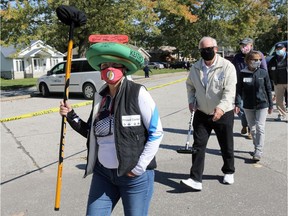 An enthusiastic group of local curlers, including Vicki Tardif, left, protested at Roseland Golf and Curling Club on Saturday, Oct. 3, 2020. They called on the city to reconsider its decision to close the facility for the season.