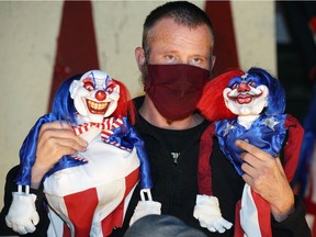 Michael K. Potter, managing director of Windsor's Post Productions theatre group, holds puppets promoting the group's presentation of the satirical play Fatboy, performing at the Shadowbox Theatre through October.