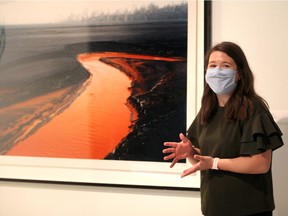 Sophie Hinch of the Art Gallery of Windsor stands by the work of Canadian photographer Edward Burtynsky. The AGW re-opens to the public on Oct. 15, 2020.
