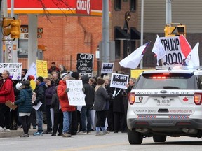 Rally participants gathered Sunday Oct. 25 at the Windsor-Essex Health Unit on Ouellette Avenue.  Windsor Police helped with traffic control as the group overflowed onto the roadway. The event was called the "great demonstration against harmful COVID-19 measures."