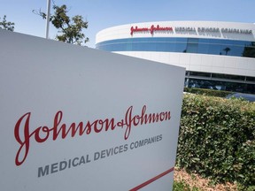 In this file photo the Johnson & Johnson logo is seen above an entrance to a building at their campus in Irvine, California on August 28, 2019.