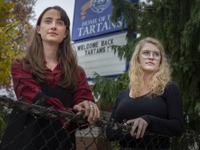 Former Walkerville Collegiate students, Alice Snaden, left, and Abrial Cooke, are pictured outside their former high school, Wednesday, Oct. 14, 2020.  The two women have launched The Power Project, whose aim is seeing changes implemented at the board and school levels "to ensure that students have a safe and accessible reporting process for abuse," according to Cooke.