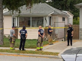 Windsor firefighters and police officers examine 1451 Pelletier St. on Oct. 10, 2020. The address was the location of a potentially intentional fire.