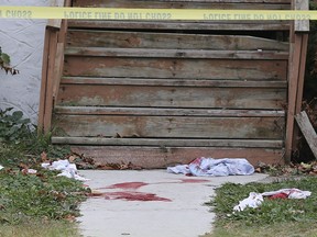 Blood stains and other evidence of stabbings are visible on a porch at 1325 Pierre Ave. in Windsor on Oct. 29, 2020.
