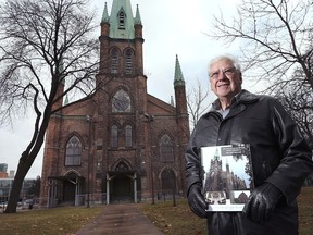 Award-winning restoration effort. Paul Mullins is shown in front of the Assumption Church in Windsor on Dec. 6, 2018.