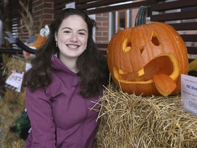 Lindsey Bareich, 14, poses with a carved pumpkin on Tuesday, Oct. 27, 2020, for the Windsor Cancer Centre Foundation's Carve 4 Cancer fundraiser.
