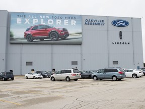 A parking lot with employees vehicles at the Ford assembly plant in Oakville, Ont., on Thursday, March 19, 2020. The federal and Ontario governments are each chipping in more than $250 million to mass produce electric vehicles, and the batteries that power them, at Ford Motor Co.'s plant in Oakville, Ontario.