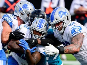 Detroit Lions running back D'Andre Swift runs the ball in for a touchdown against the Jacksonville Jaguars during the second half at TIAA Bank Field.