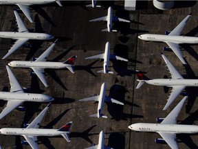 Investors are hunting for deals in the ailing travel industry. Here, Delta Air Lines passenger planes are seen parked due to flight reductions made to slow the spread of coronavirus disease (COVID-19), at Birmingham-Shuttlesworth International Airport in Birmingham, Alabama, March 25, 2020.