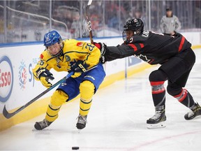 The Detroit Red Wings made Swedish forward Lucas Raymond, at left, during Hlinka Gretzky Cup action in Edmonton on Aug. 8, 2018, the fourth pick overall in Tuesday's first round of the NHL Draft.
