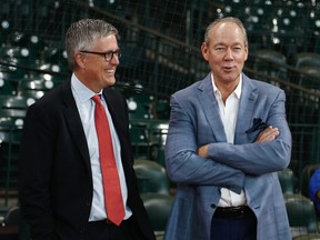 Astros owner Jim Crane, right, and general manager Jeff Luhnow chat during battting practice at Minute Maid Park in Houston, on June 30, 2017.