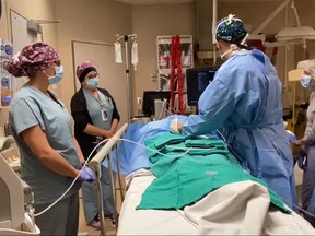 Dr. Matthew Rochon, lead physician for interventional radiology at Windsor Regional Hospital, performs microwave ablation on a liver tumour on Oct. 19, 2020.