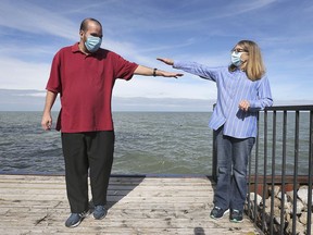 Tom Taylor and his mother Linda Taylor do a quick social distancing check before a photo at her Lakeshore, home on Tuesday, October 20, 2020. Tom lives in a congregate care setting home in Windsor and was not able to visit his mother for months due to pandemic protocols.