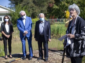 Members of the Solcz family, from left, Mary, Michael, and Len, listen as Catharine Shanahan, executive director of Family Respite Services, speaks during a groundbreaking event for the new accessible Solcz Foundation Respite Home at 4400 Howard Ave., Tuesday, Oct. 13, 2020.