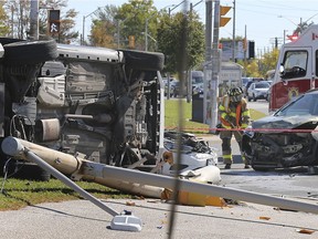 A firefighter is shown on the scene of a three-vehicle collision on Monday, Oct. 5, 2020, on Howard Avenue in front of the Devonshire Mall. The accident occurred at approximately 2 p.m. and emergency crews said injuries were not serious.