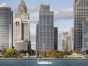 A sailboat cruises past downtown Detroit on Oct. 21, 2020.