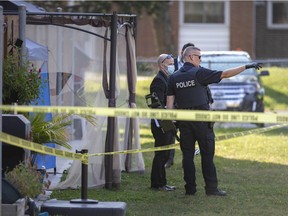 Windsor police investigate after an early morning shooting behind a row of townhomes at 2611 Lauzon Rd., Friday, October 9, 2020.