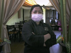 Renu Anderson, owner of Thai Palace restaurant is shown at the east Windsor business on Wednesday, October 14, 2020. A lawyer is claiming discrimination and threatening to sue the restaurant, with a demand of $20,000 to make the litigation go away, after Anderson insisted he wear a mask to pick up food at the restaurant's outdoor takeout window.