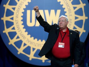 FILE PHOTO: United Auto Workers union president Dennis Williams raises his arm in solidarity after his farewell speech during the 37th Constitutional Convention in Detroit, Michigan, U.S. June 13, 2018.