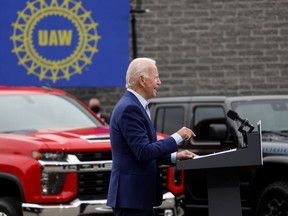 FILE PHOTO: Speaking in front of a backdrop of American-made vehicles and a United Auto Workers (UAW) sign, Democratic U.S. presidential nominee and former Vice President Joe Biden speaks about new proposals to protect U.S. jobs during a campaign stop in Warren, Michigan, U.S., September 9, 2020.