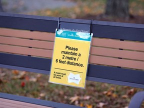 COVID-19 prevention signage on benches at Windsor Regional Hospital November 11, 2020.