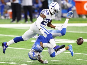 Xavier Rhodes of the Indianapolis Colts breaks up a pass intended for Kenny Golladay of the Detroit Lions during the first quarter at Ford Field on November 01, 2020 in Detroit, Michigan.