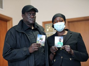 James Riek and Rebecca Yat, parents of Kuothhorko (Kuzi) James at Windsor Adventist Church and Elementary School on Rivard Avenue Tuesday.