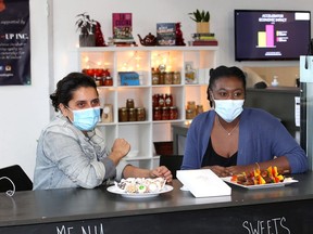 Delna Buhariwalla and Trishauna Linton, right, co-founders of Cook-up Inc. at their take-out counter inside Downtown Windsor Business Accelerator Wednesday.