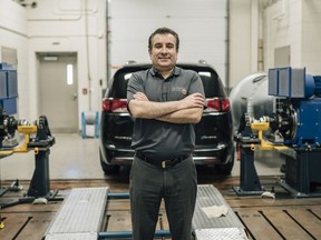 Dr. Ali Emadi, Professor, Canada Excellence Research Chair Laureate and NSERC/FCA Industrial Research Chair in Electrified Powertrains, McMaster University pictured with the Chrysler Pacifica Hybrid minivan at the McMaster Automotive Resource Centre (MARC) at McMaster University in Hamilton, Ontario.